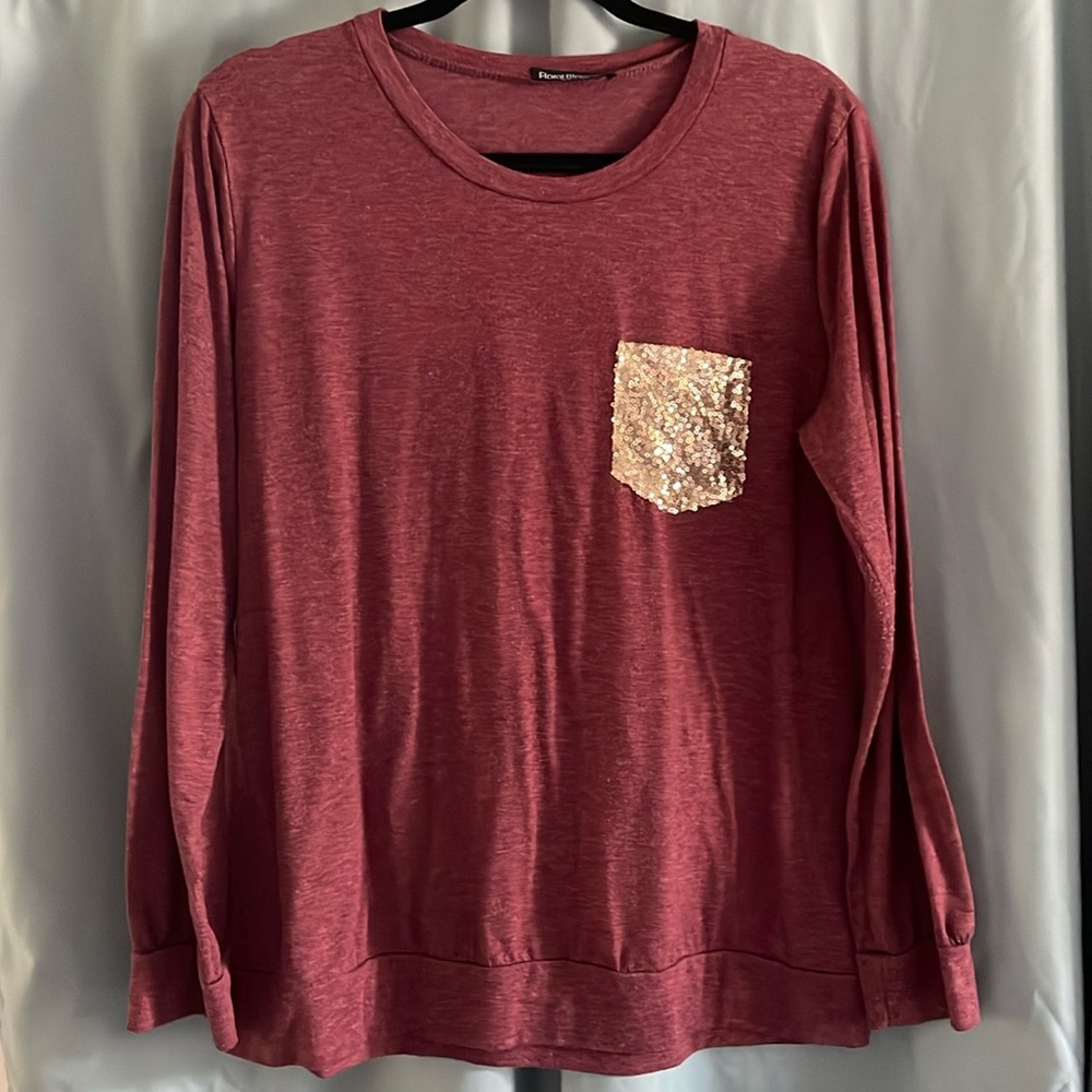 Red long-sleeve top w/ gold pocket detailing